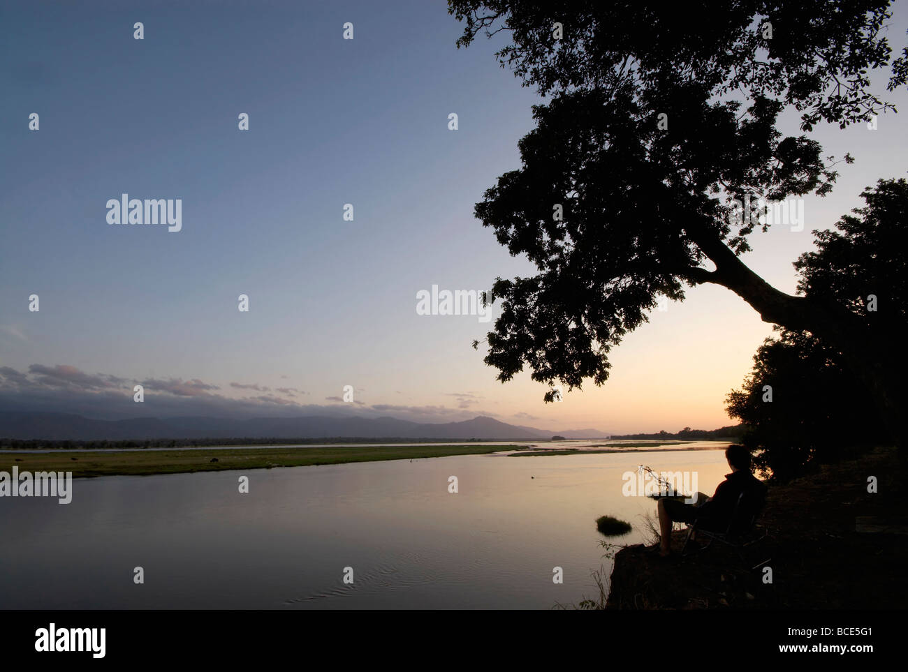 Sunrise on the Zambezi store River, a view of Zambia and Mozambique from the Zimbabwean shore - Landscape Acrylic Print