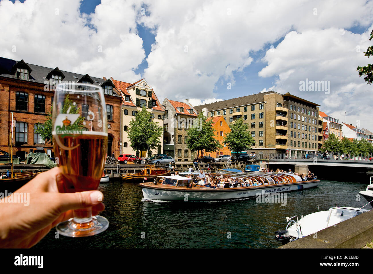 Cheers to the sightseeing boat in Christianshavn canal Stock Photo