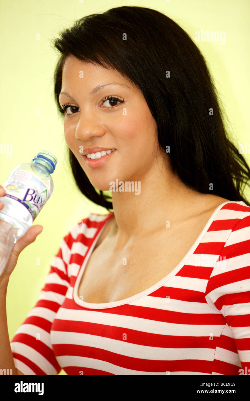 Healthy Young Woman Drinking Mineral Water Model Released Stock Photo