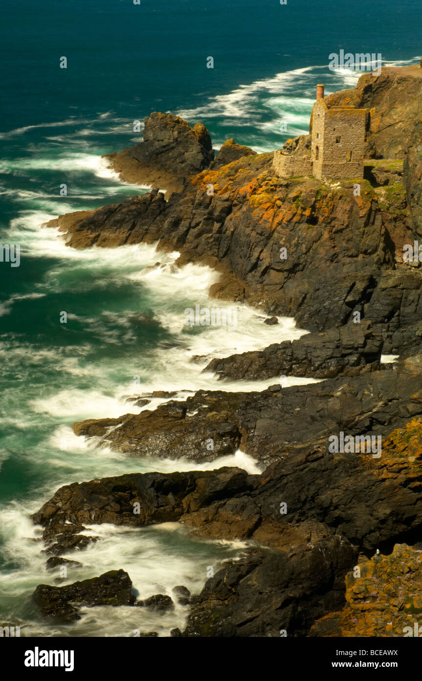 Rough seas crashing into the rocks below the old ruins of Crown mines at Botallack on the Cornish coast St Just UK Stock Photo
