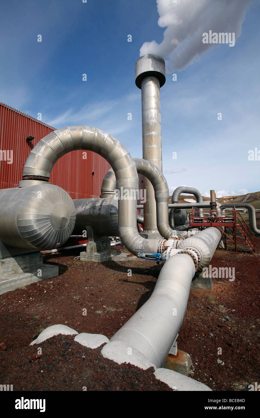 Pipes carry pressurized steam and water from boreholes to the separator at the geothermal power station at Krafla, Iceland Stock Photo
