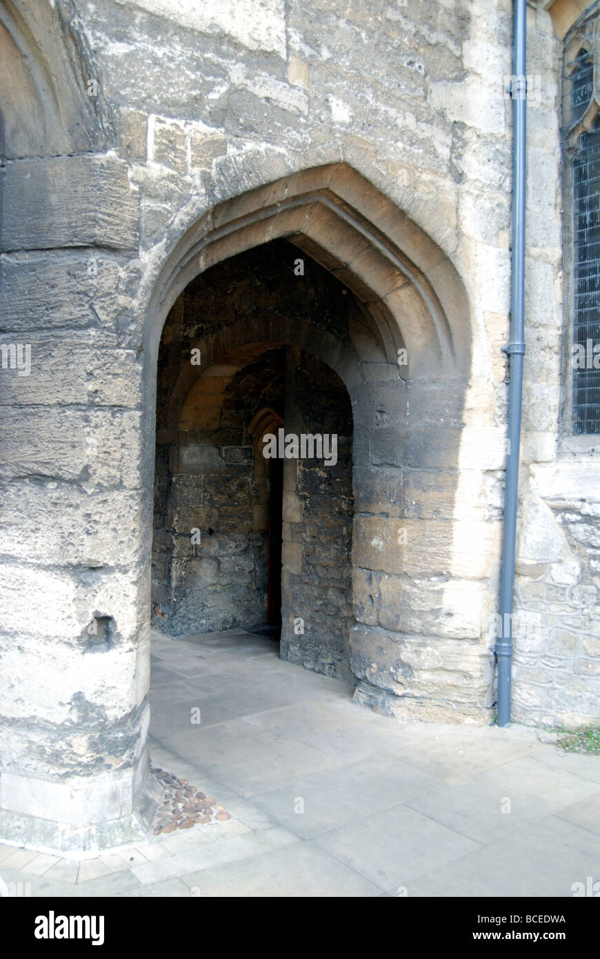 A stone archway beside St Nicholas Church at the Marketplace in Abingdon in Oxfordshire Stock Photo