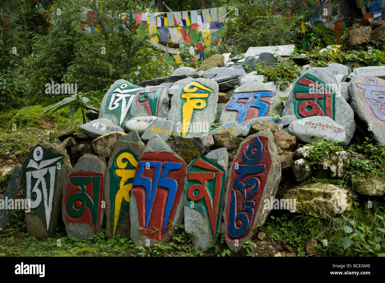 Tibetan Mani stones on the Kora path (ritual circuit) around the Tsuglagkhang Complex. McCleod Ganj. Himachal Pradesh. India. Stock Photo
