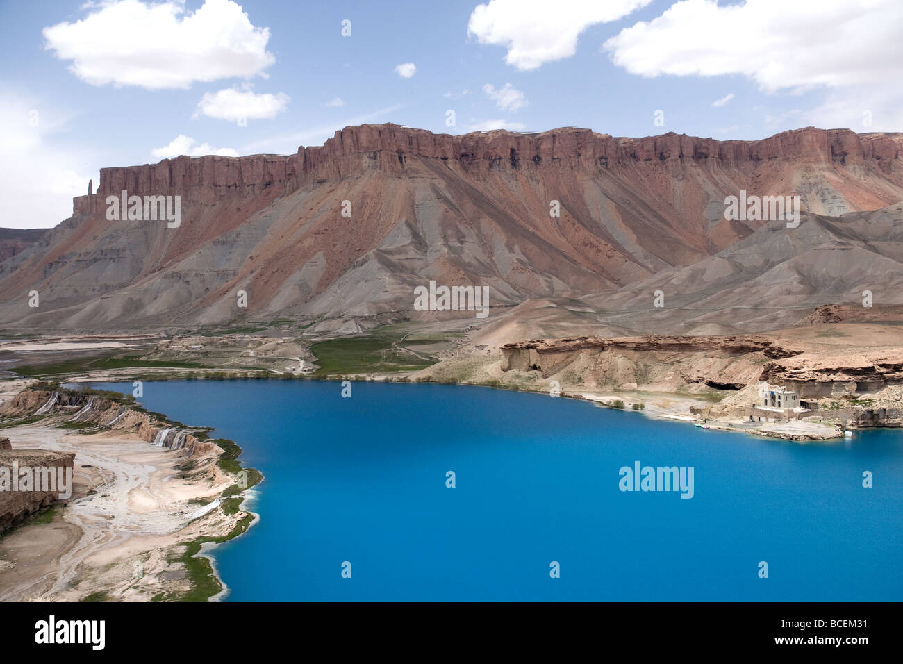 A shrine, right, is on the shore of Haibat, one of six lakes of Band-e Amir, declared Afghanistan's first national park in 2009 Stock Photo