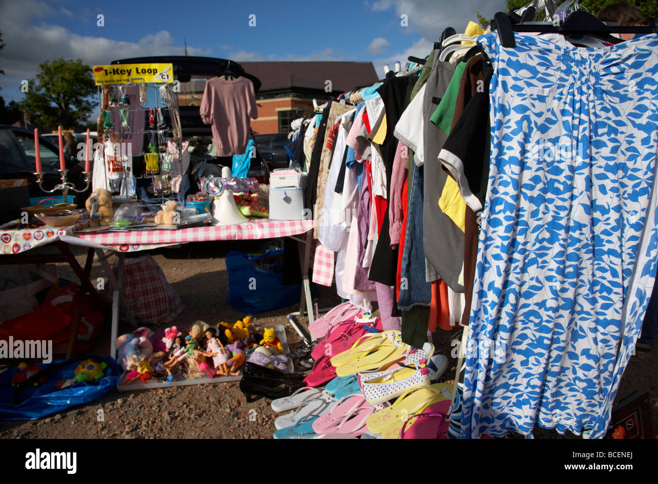 rail of 2nd hand womens clothes for sale at a car boot sale in newtownabbey northern ireland uk Stock Photo
