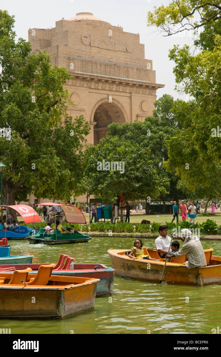 Families enjoy rowing in a pond in front of India Gate New Delhi India