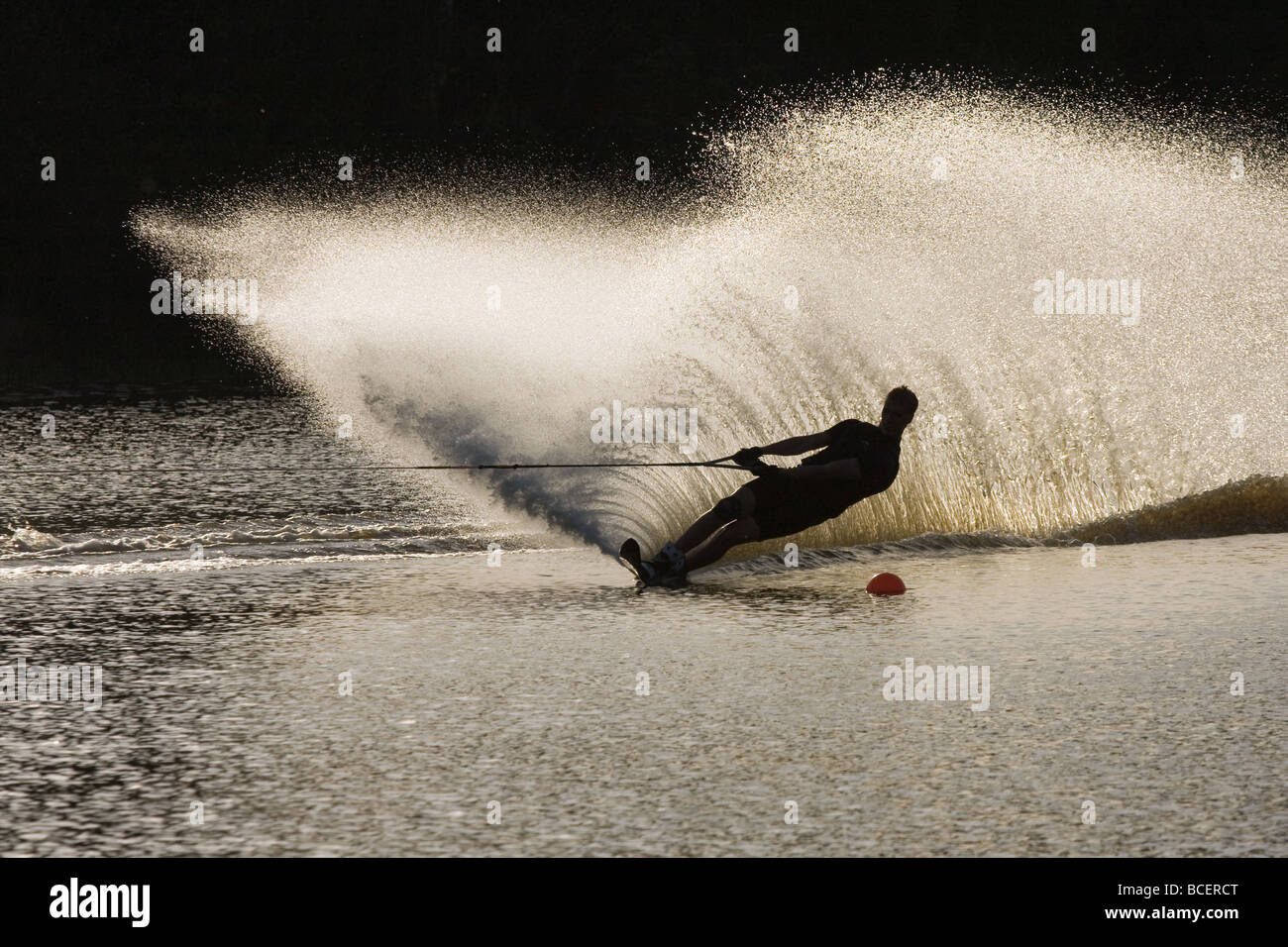 A man practicing water ski slalom in a lake in Sweden Stock Photo