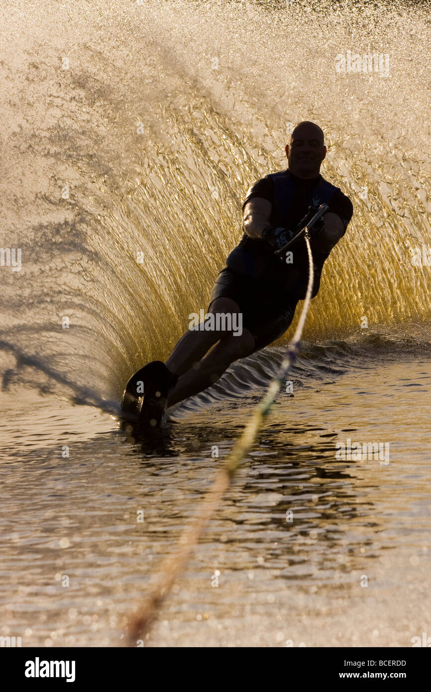 A man practicing water ski slalom in a lake in Sweden Stock Photo