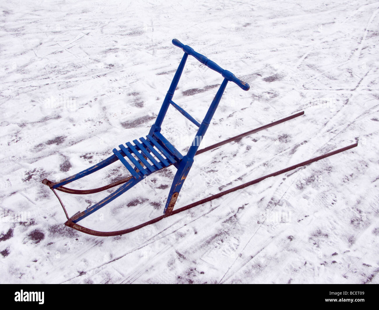 A blue kick-sled on a lake in Sweden Stock Photo