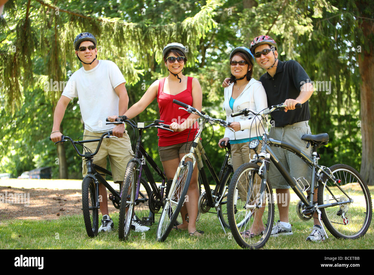 Asian family with bicycles Stock Photo