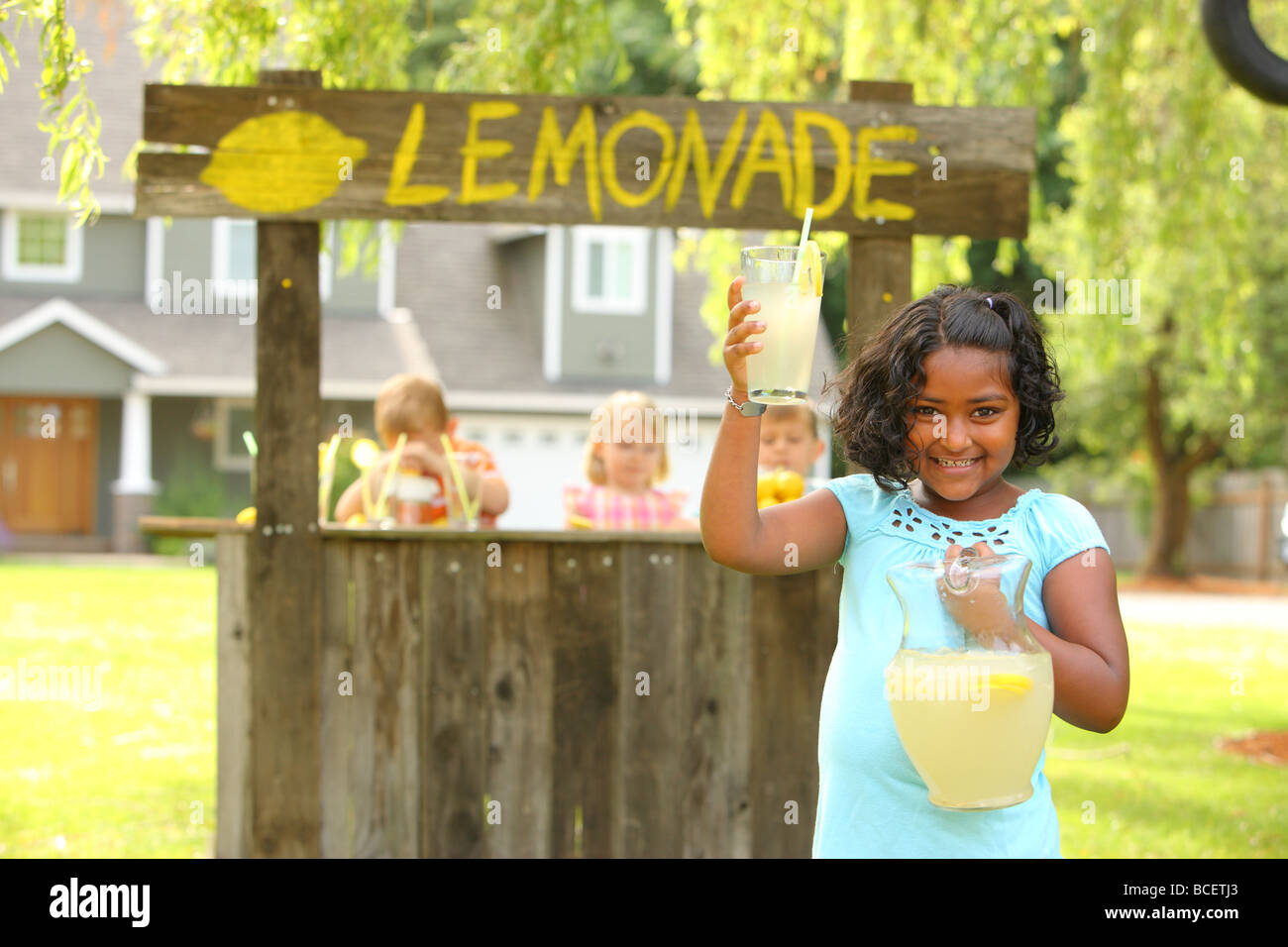 Young girl in front of lemonade stand Stock Photo