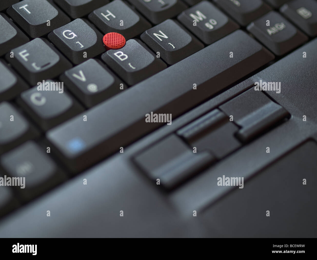 Detail of a Lenovo/IBM notebook keyboard with trackpoint and touchpad. Stock Photo