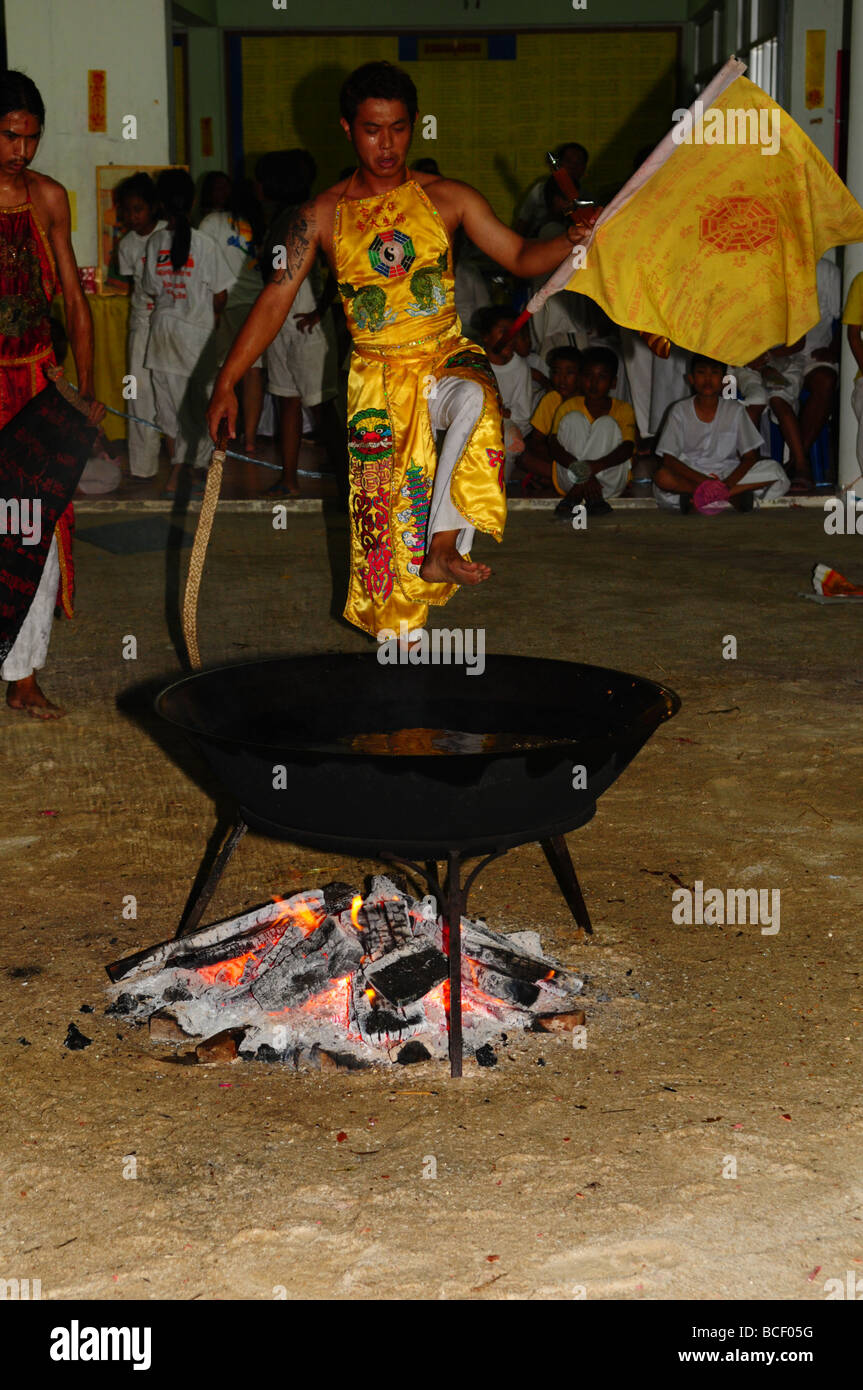 Devotee is getting read to perform oil bathing,t Phuket Vegetarian Festival 2008 Stock Photo