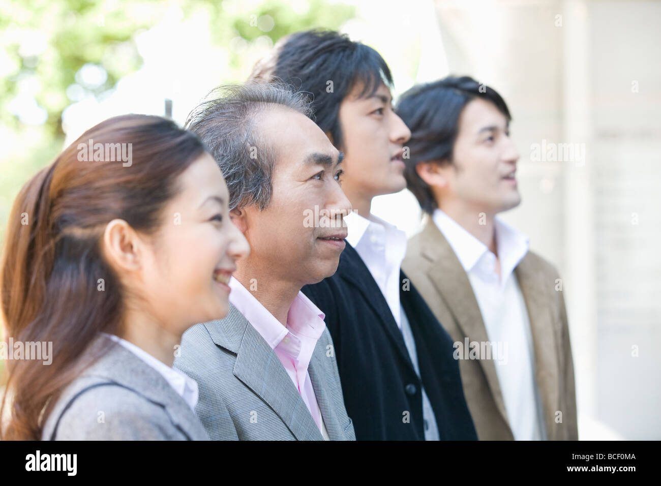 Portrait of four business people Stock Photo - Alamy