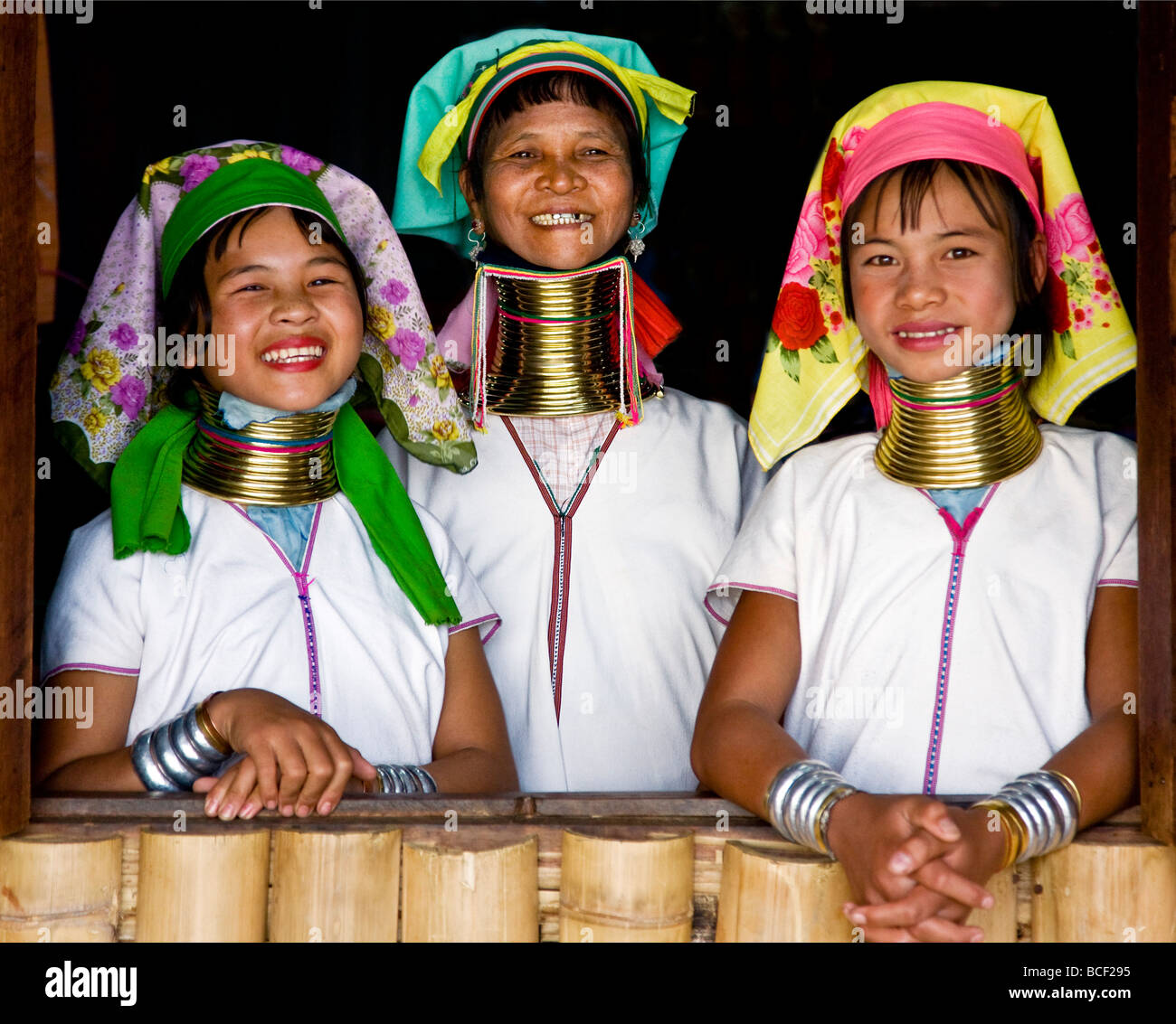 Myanmar, Burma, Lake Inle. Happy Padaung women belonging to the Karen  sub-tribe wearing their heavy brass necklaces. Stock Photo
