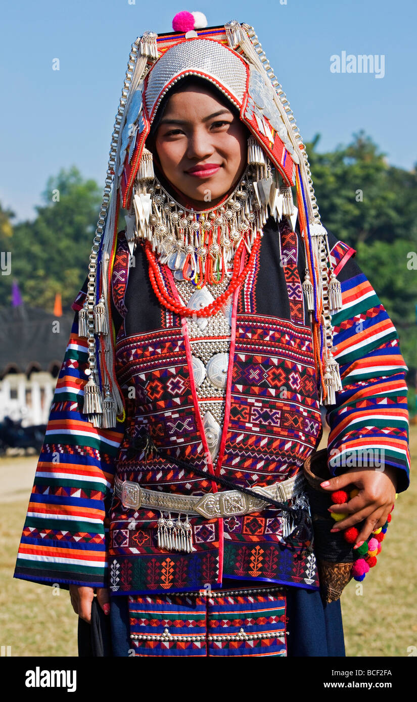 Myanmar, Burma, Kengtung. An Akha woman wearing traditional costume with a headdress of silver and beads. Stock Photo