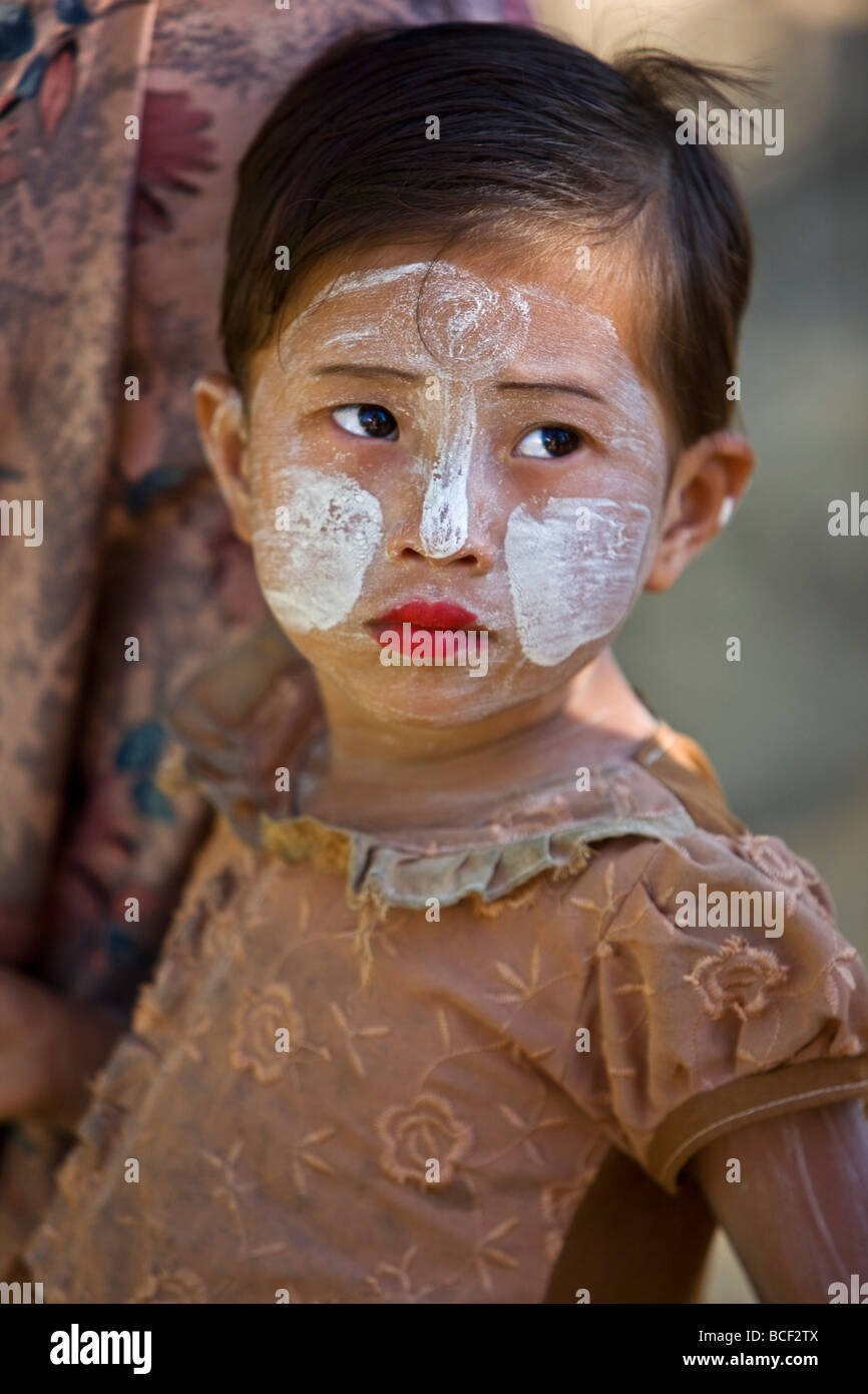 Myanmar, Burma, Mrauk U. A young That girl at Mrauk U with her face decorated with Thanakha, a popular local sun cream. Stock Photo