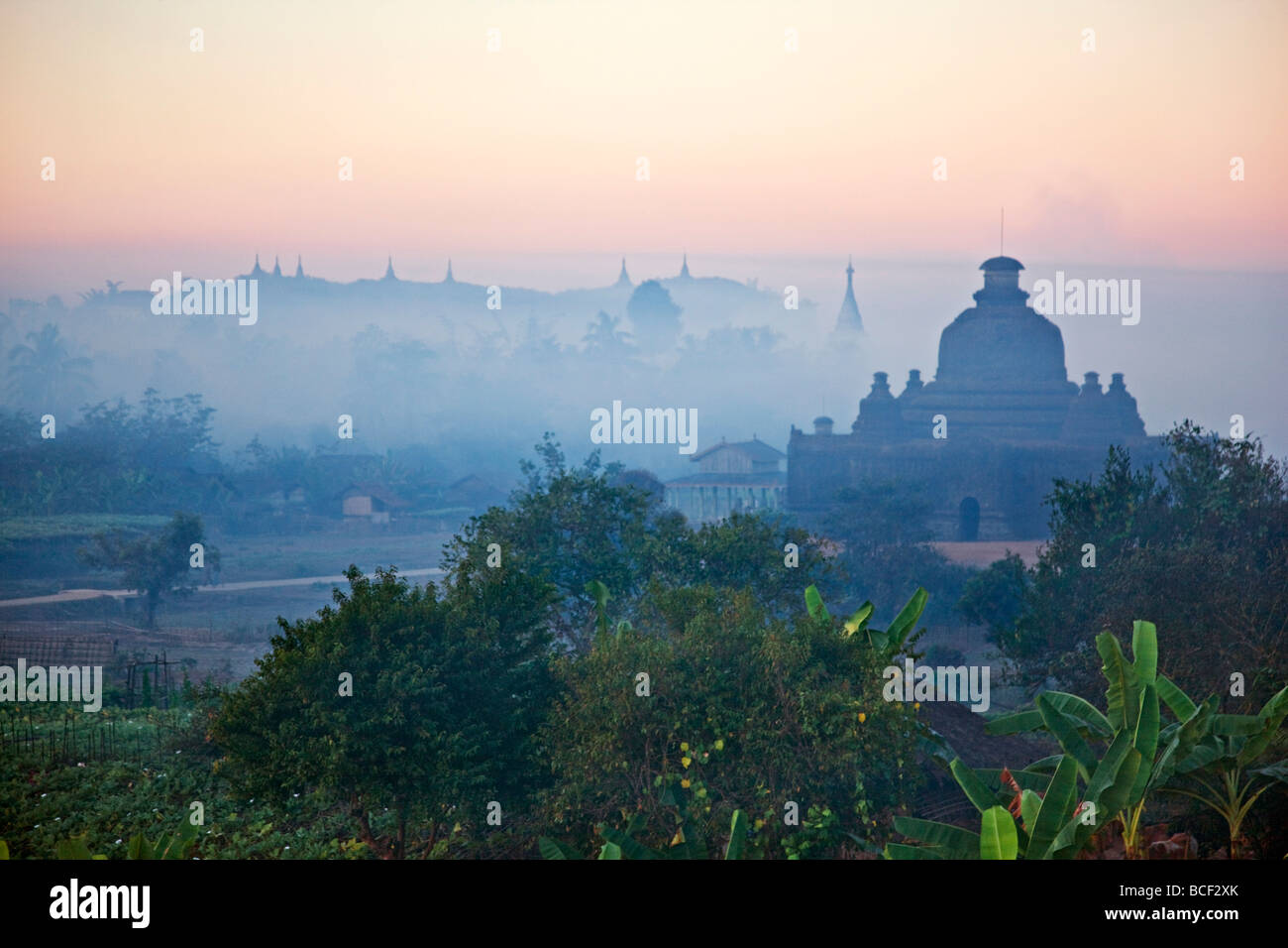 Early morning mist shrouds the historic temples of Mrauk U, built in the Rakhine style between the 15th and 17th centuries. Stock Photo
