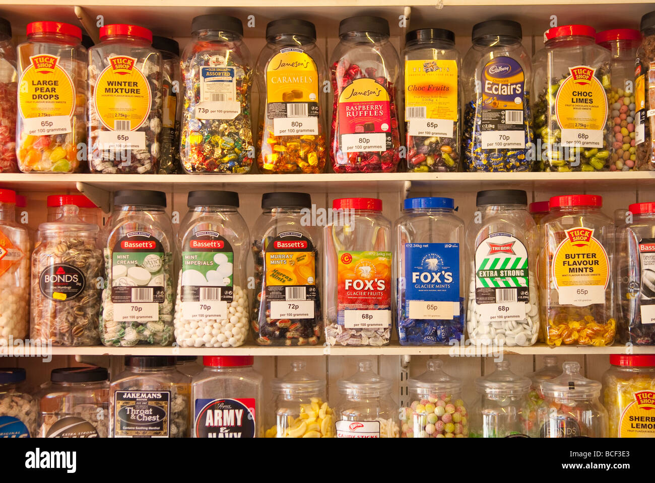 Jars of sweets on shelves at a traditional sweet shop in the Uk Stock