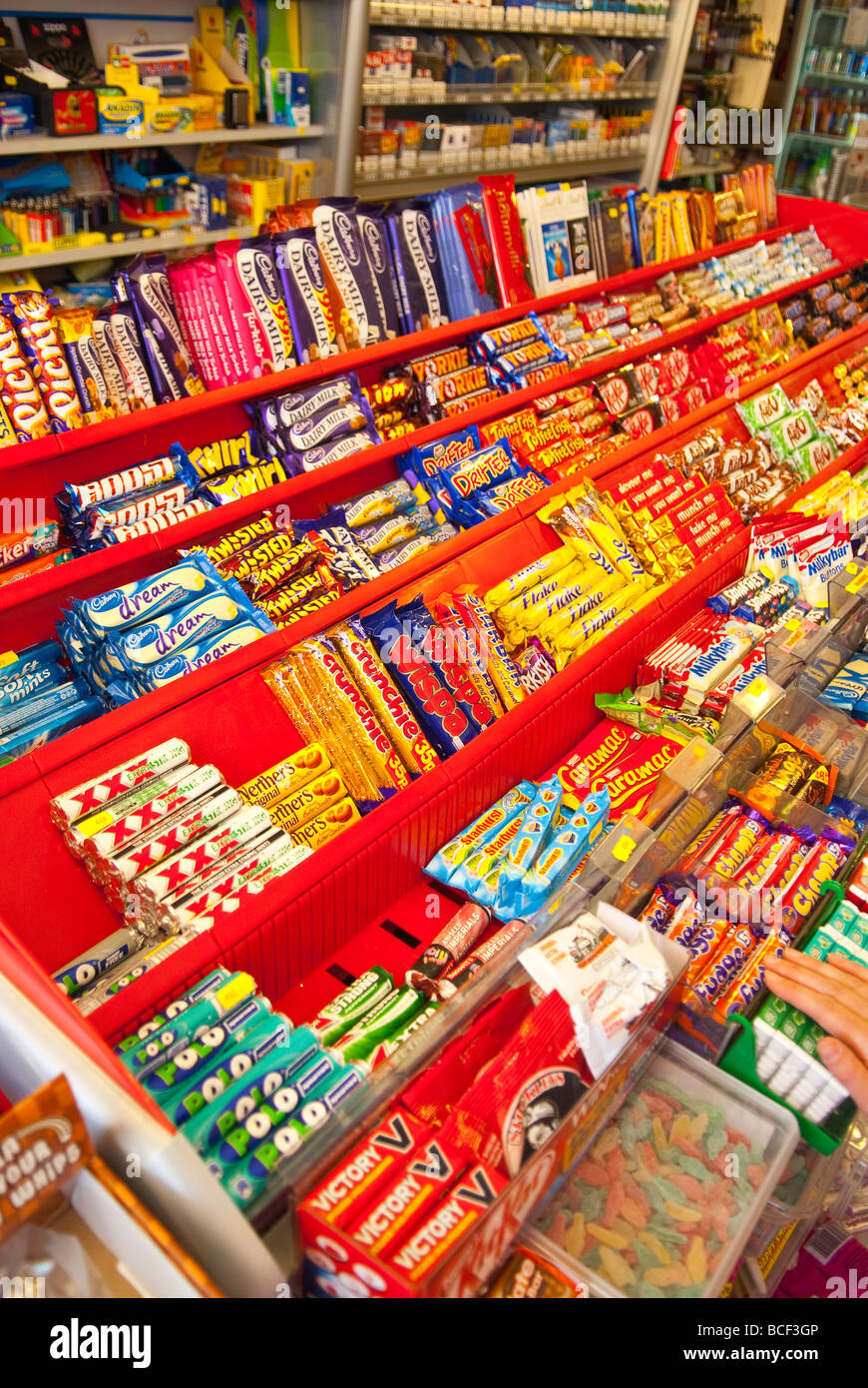 Chocolate bars and sweets for sale in a Uk sweet shop store Stock Photo