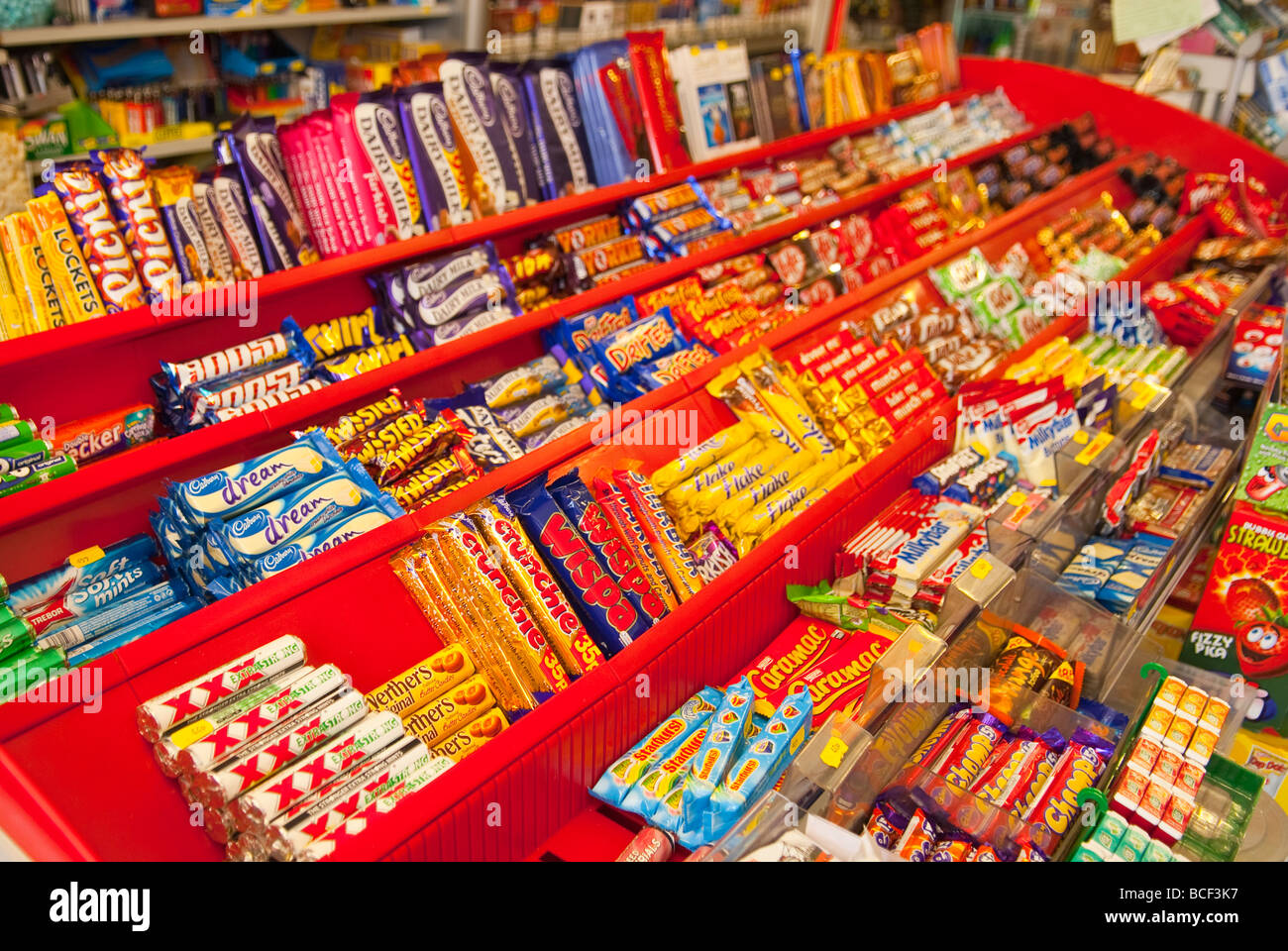 Chocolate bars and sweets for sale in a Uk sweet shop store Stock Photo