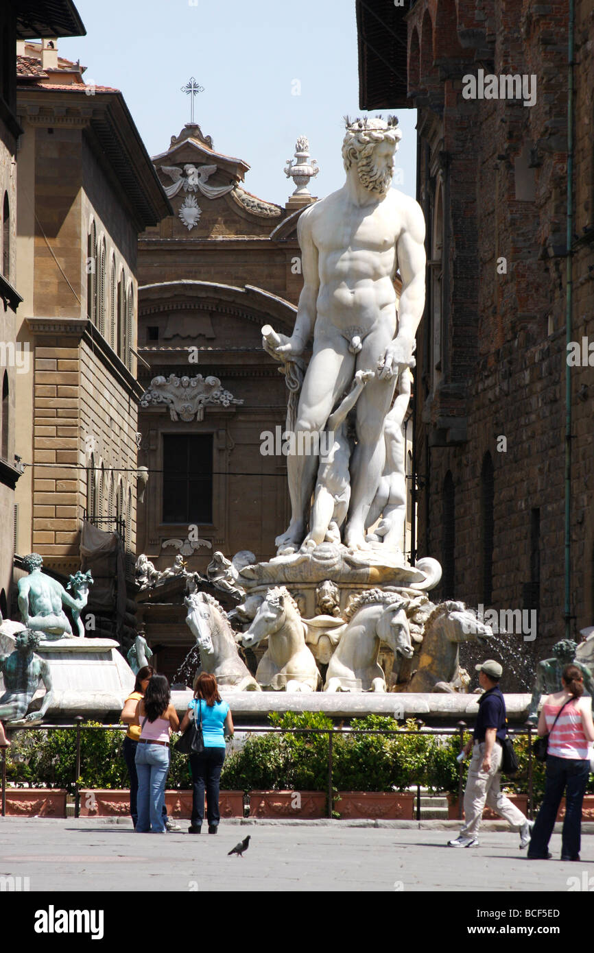 Statue of Neptune in a fountain surrounded by nymphs in white marble in the Piazza della  Signoria,Florence Stock Photo
