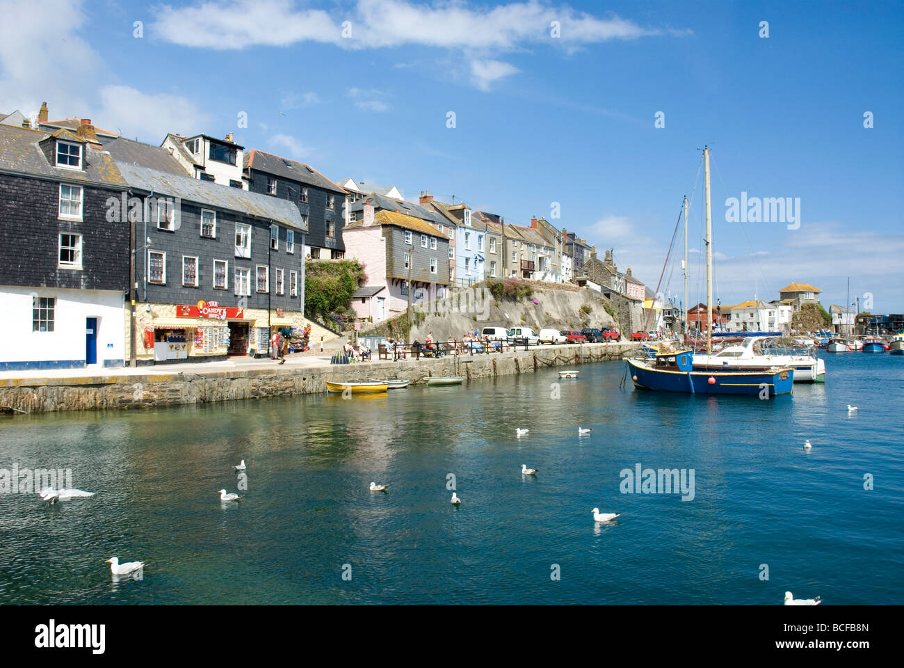 The Quayside at Mevagissey with boats in harbour Cornwall England Stock Photo