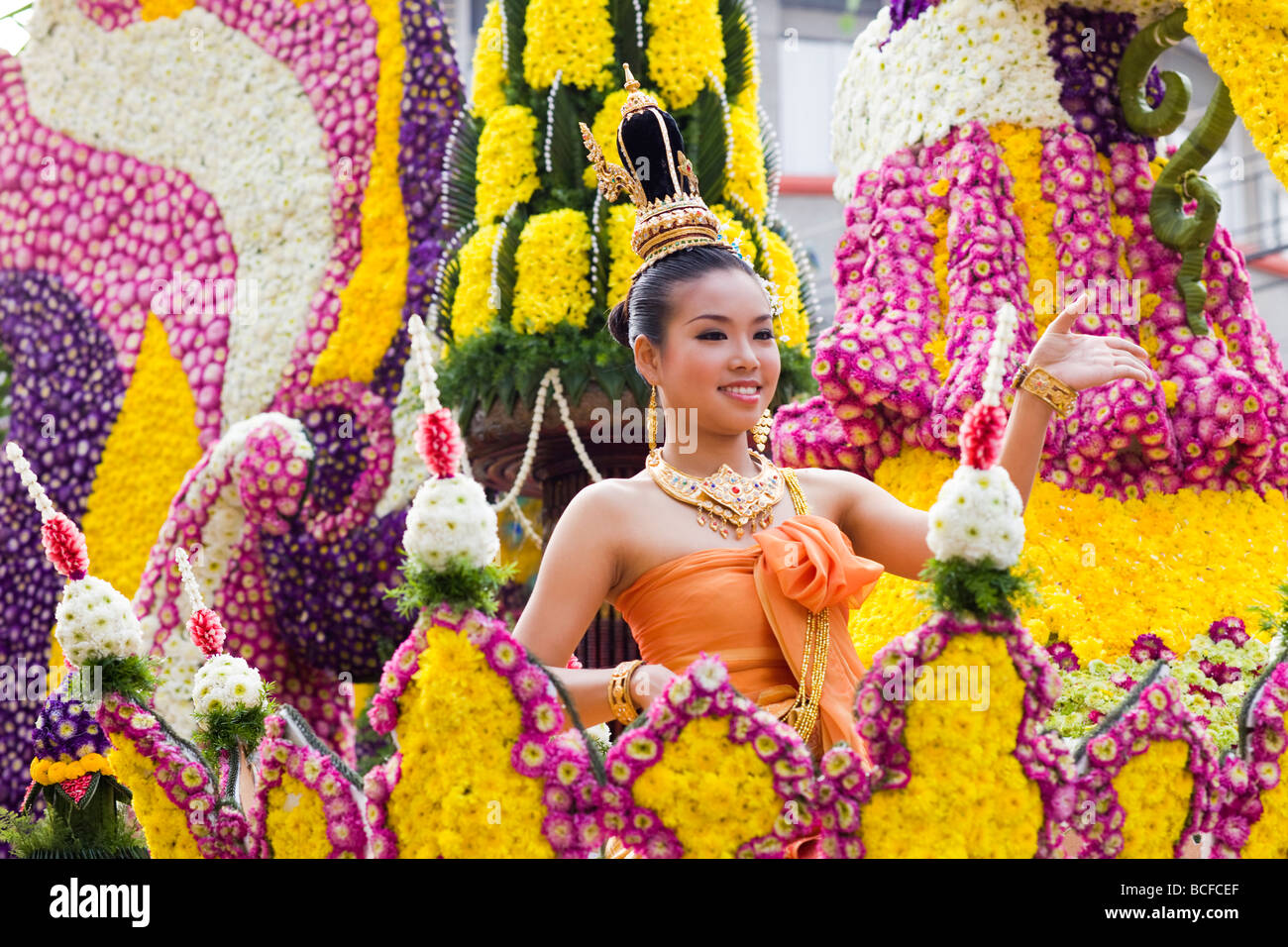 Thailand, Chiang Mai, Girl on Floral Float at Chiang Mai Flower Festival Parade Stock Photo