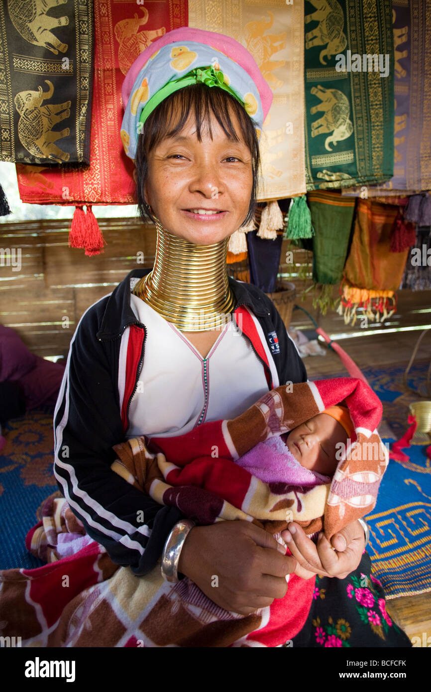 Thailand, Golden Triangle, Chiang Rai, Long Neck Karen Hilltribe, Long Neck Woman with Baby Stock Photo