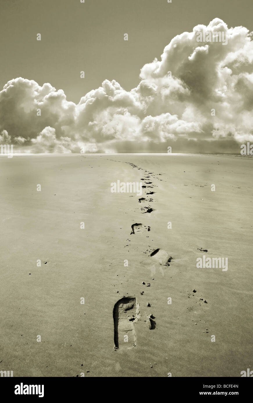 footprints disappear off to the the distant horizon of just clouds Stock  Photo - Alamy