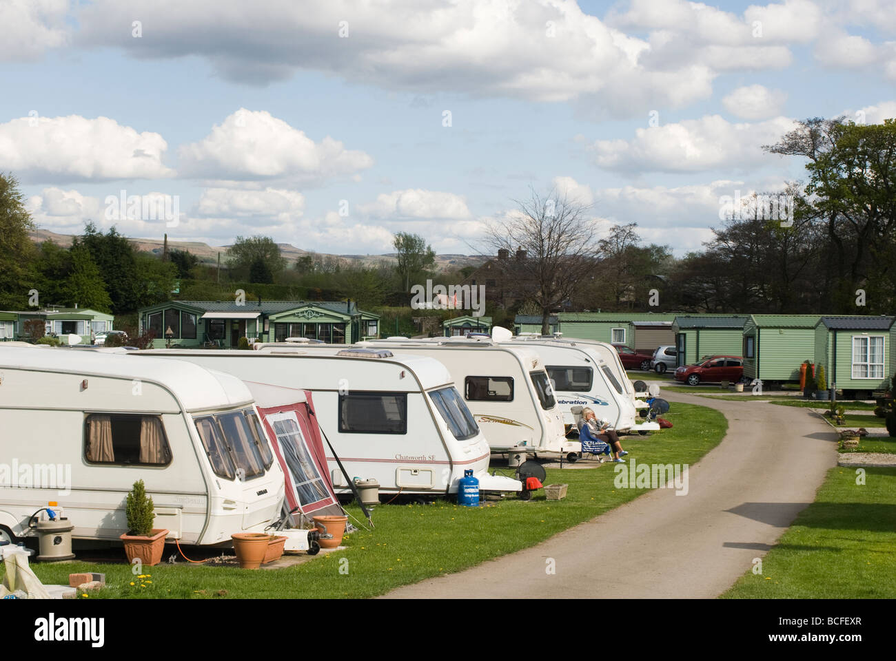 Rows of touring caravans and static caravans on a campsite in Derbyshire on a sunny summers day Stock Photo