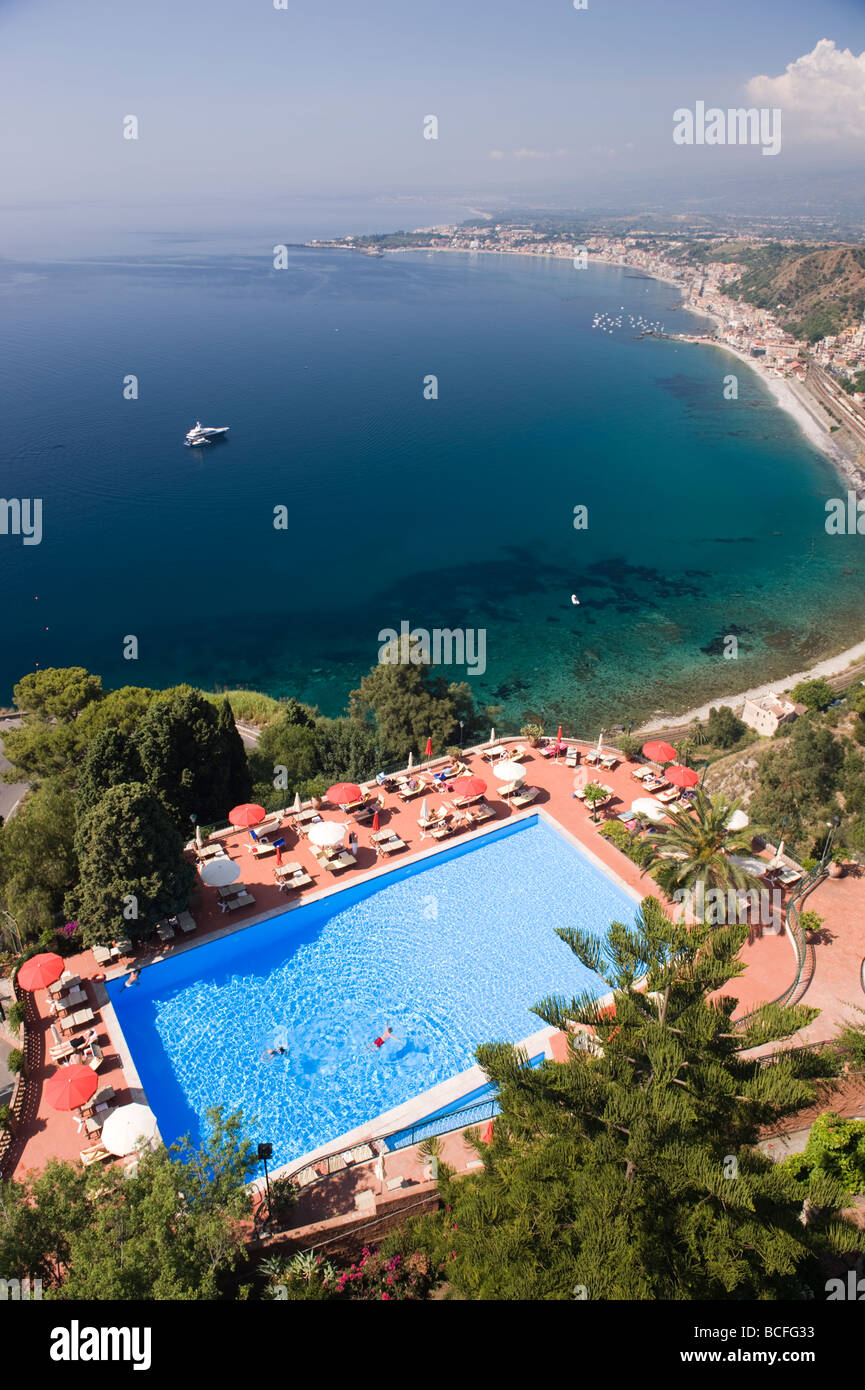 Swiiming pool of Hotel Diodoro, Taormina, Sicily looking toward bay of Giadini Naxos. Stock Photo
