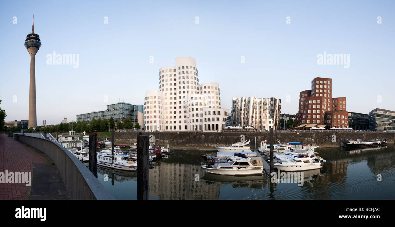 panoramic view of Dusseldorf MediaHarbor with Rhine tower, marina and Frank O. Gehry'S Neuer Zollhof buildings Stock Photo