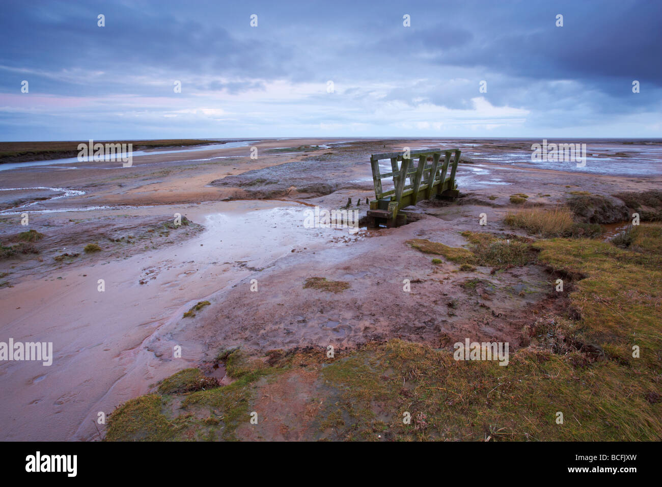 A moody morning at Stiffkey on the North Norfolk Coast showing the vast Saltmarshes Stock Photo