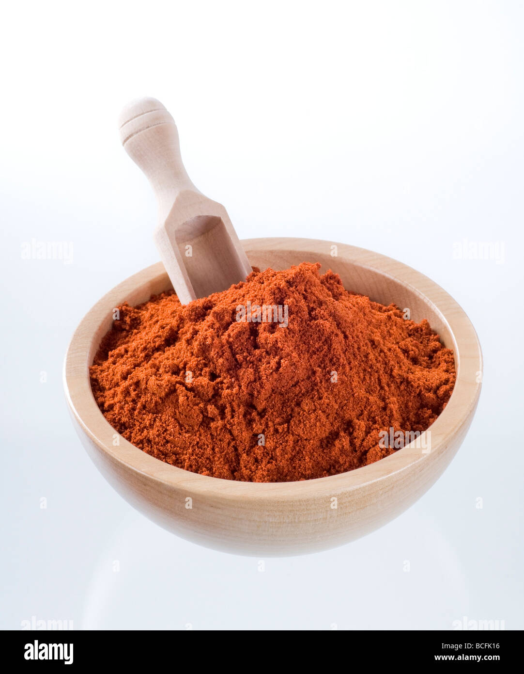 Pepper shaker of ground paprika pepper on a wooden background Stock Photo -  Alamy