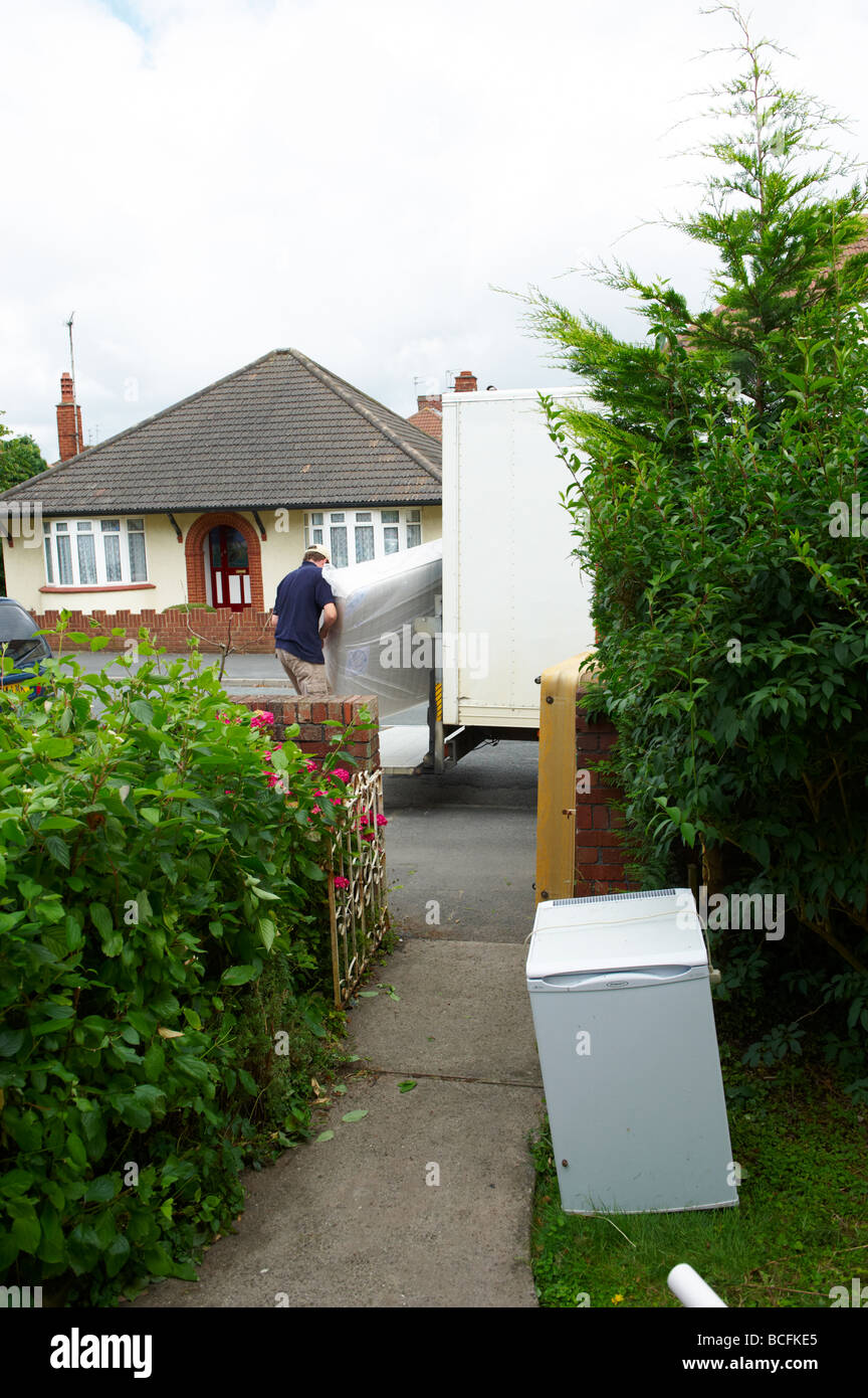 House and Furniture removals with removal men carrying loads Stock