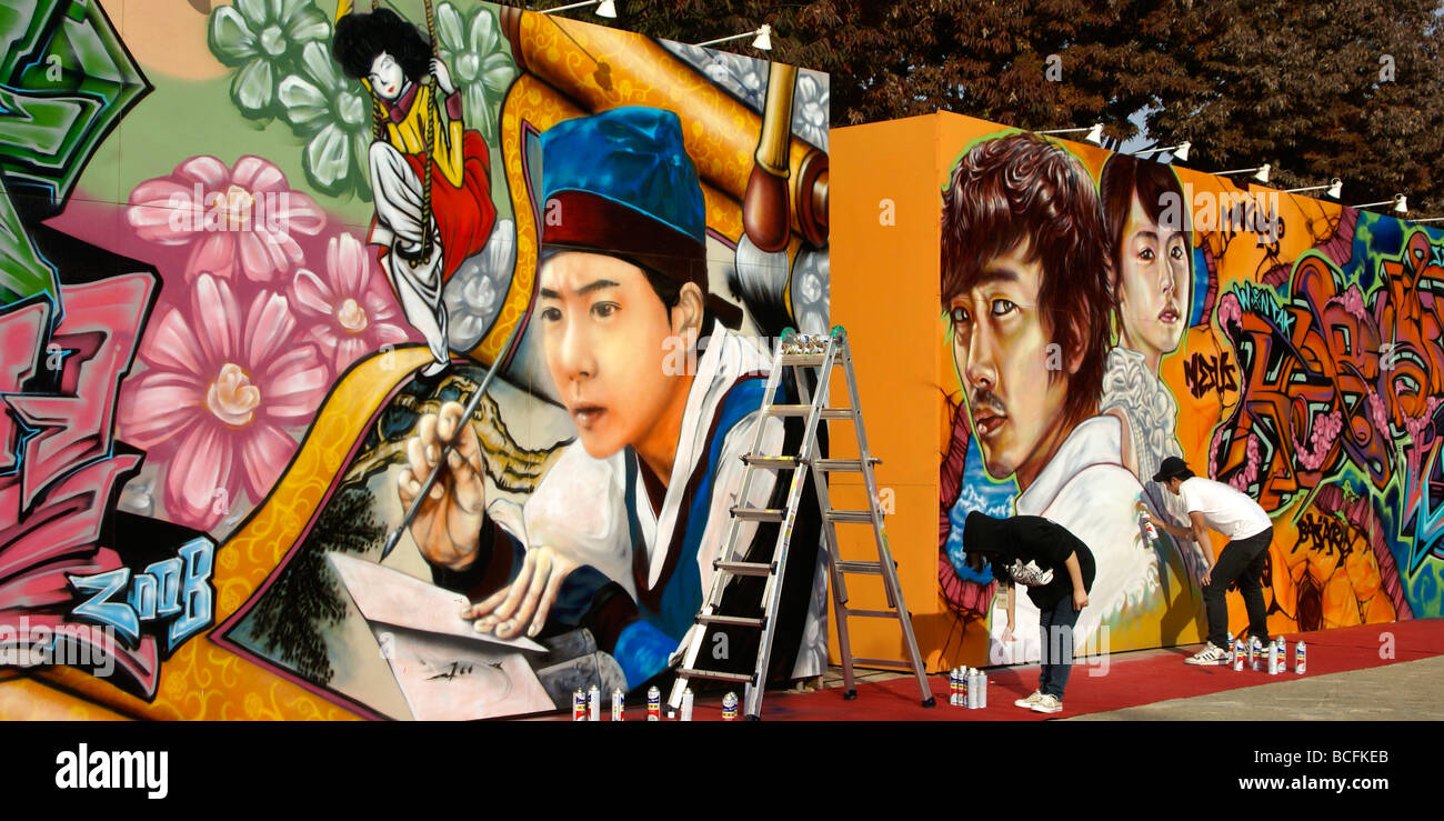 Artists painting graffiti at festival, Jinju Fortress, Seoul, South