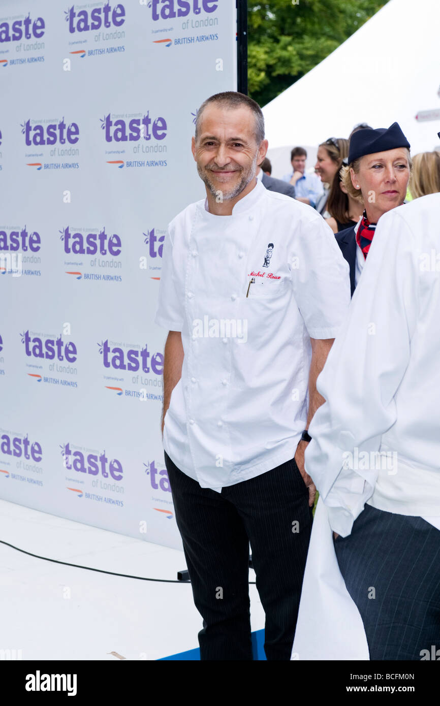 Taste of London , celebrity master chef Michel Roux Jnr in whites jokes with peers at opening ceremony of exhibition Stock Photo