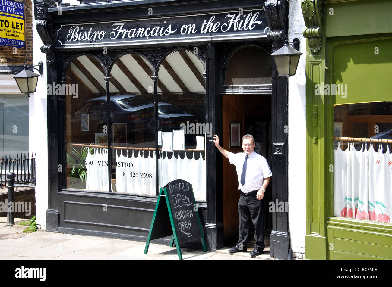 French Bistro restaurant and owner, High Street, Harrow-on-the-Hill, London Borough of Harrow, Greater London, England, United Kingdom Stock Photo