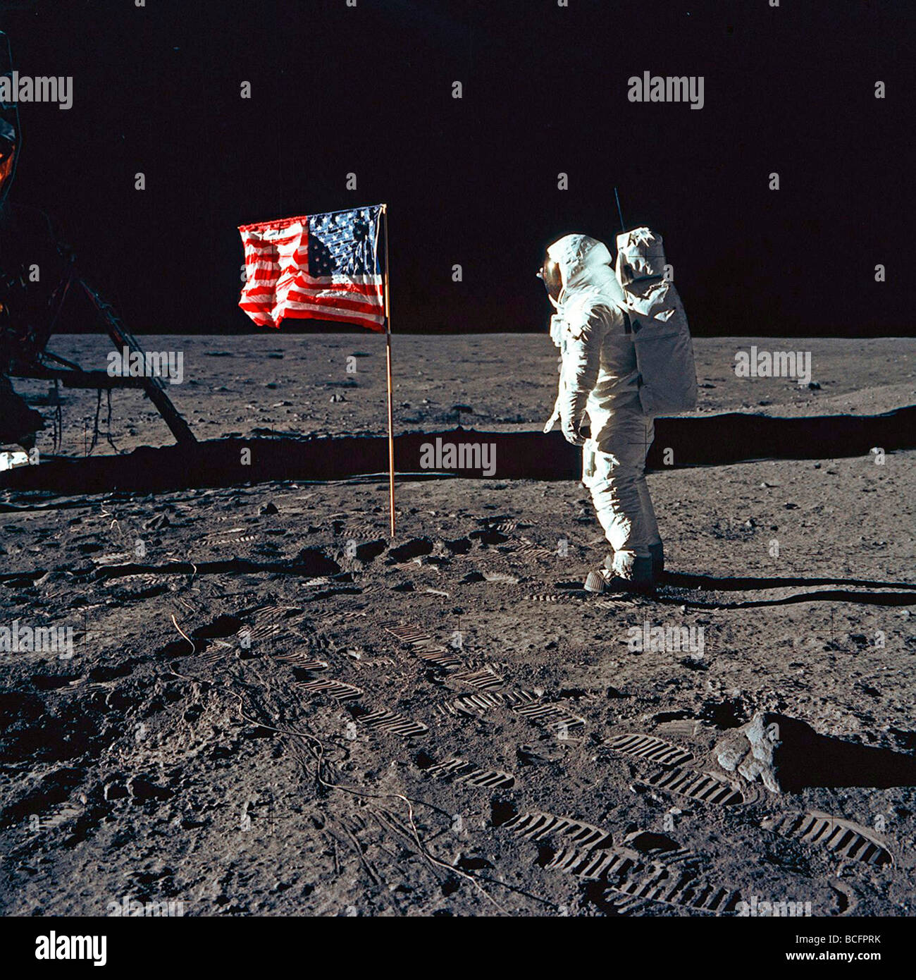 NASA astronaut Buzz Aldrin and American flag on moon Stock Photo
