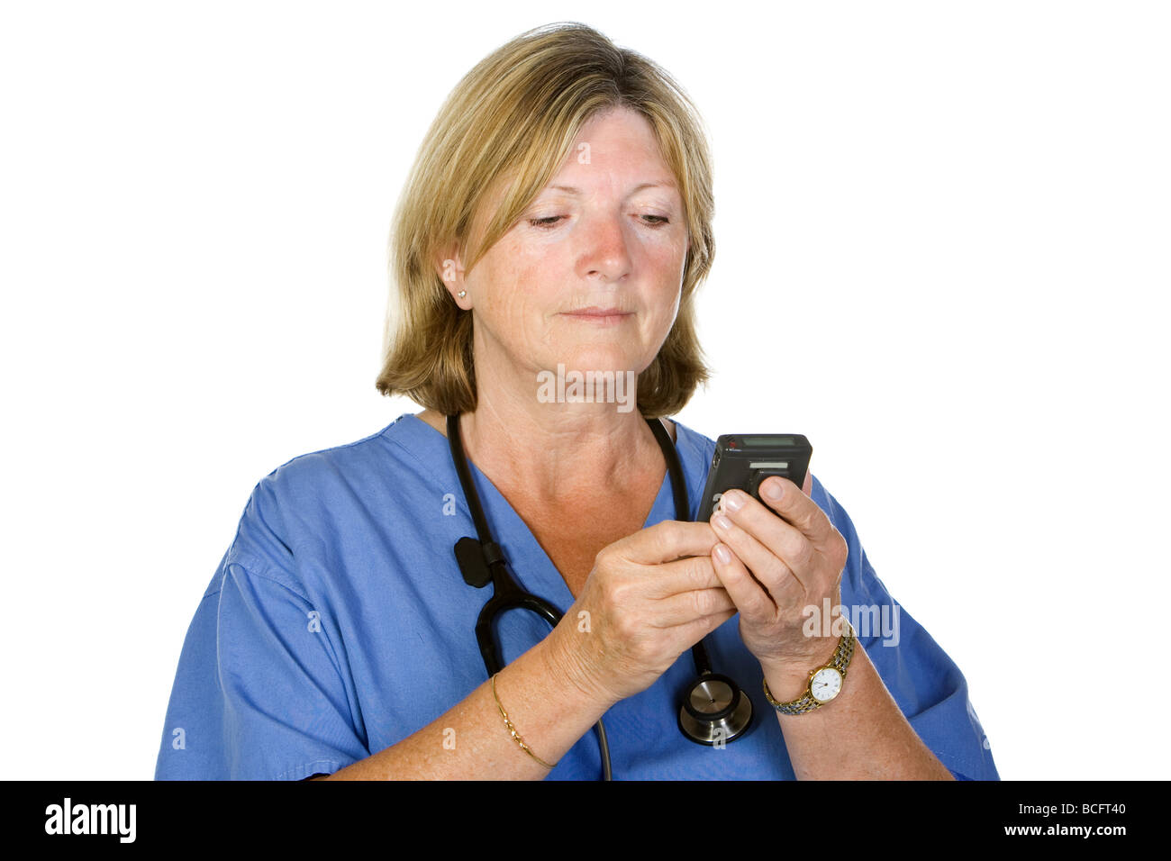 Senior Female Doctor Checking Pager on White Background Stock Photo