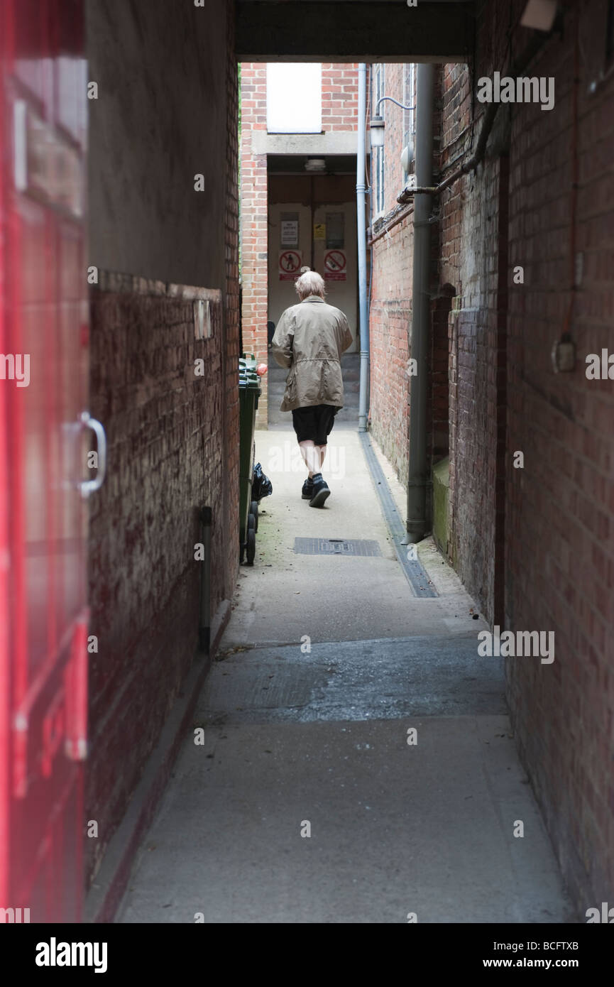 Man walking down an Alley. Stock Photo