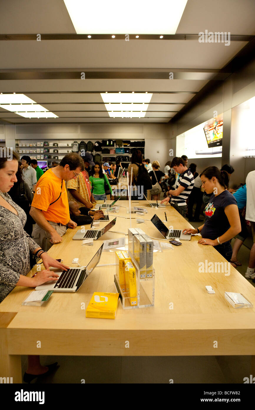 An Apple Store with People Waiting To Purchase Apple Macbooks, IPads and  IPhones Editorial Image - Image of designs, ecosystem: 168250490