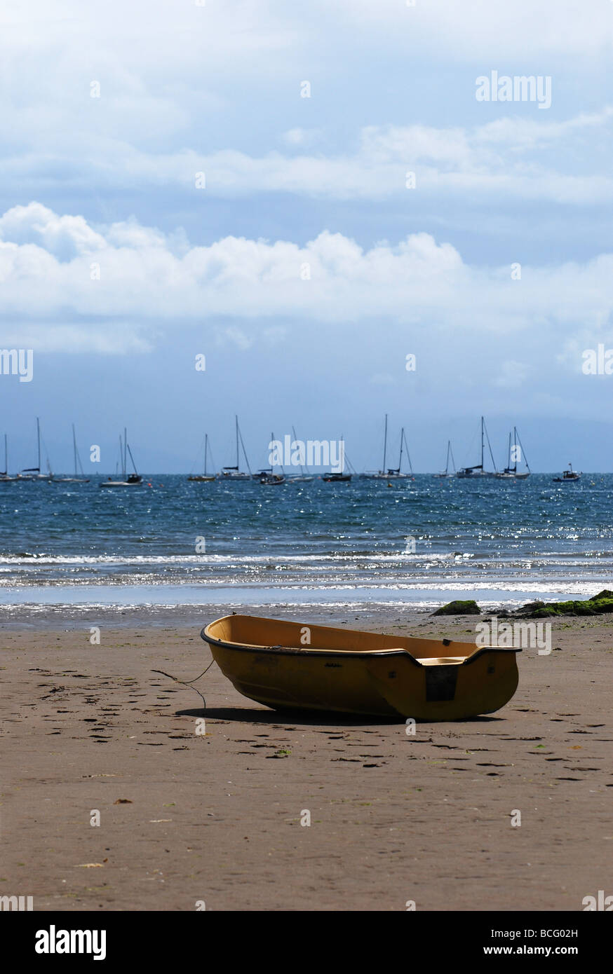 yellow tender beached at abersoch no 2734 Stock Photo