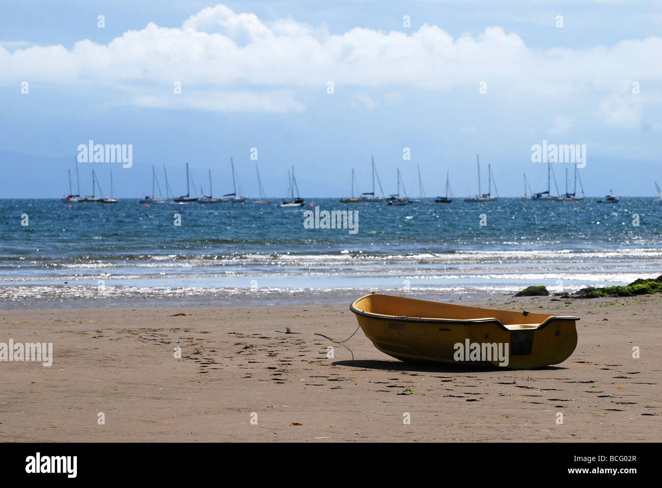 yellow tender beached at abersoch no 2735 Stock Photo