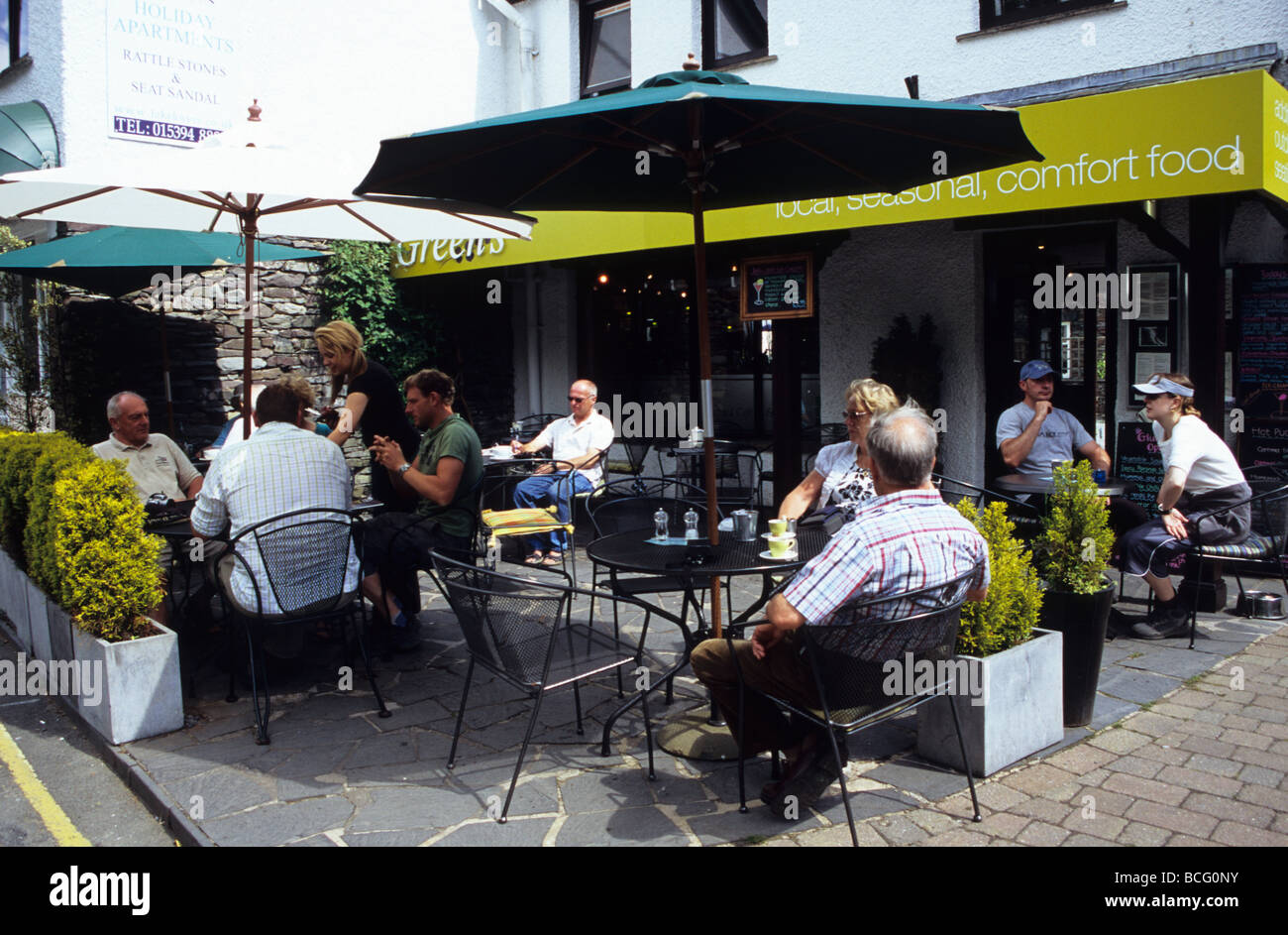 People Being Waited On At A Modern Cafe In Grasmere Cumbria Stock Photo