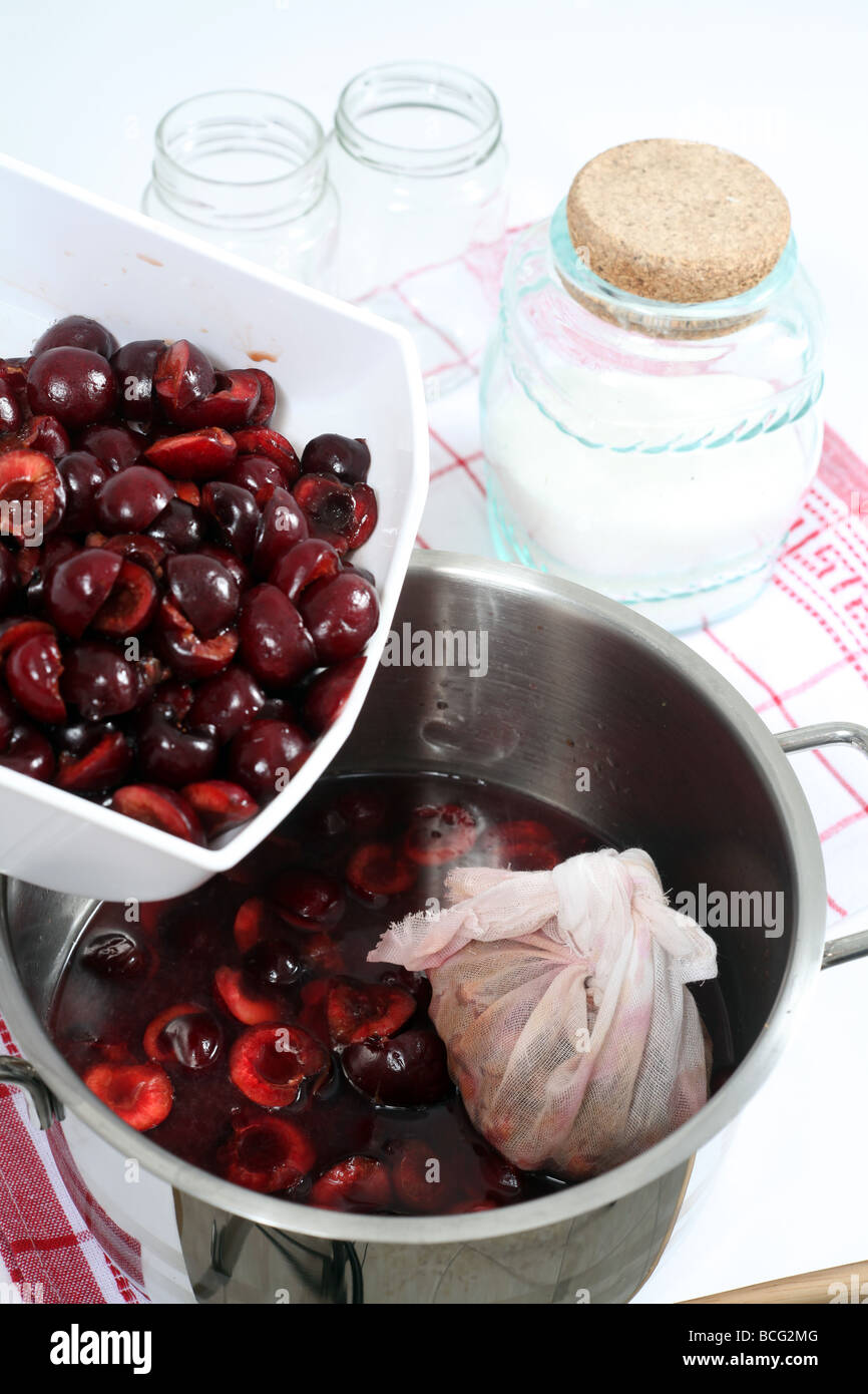 Jam Making - straining fruit through muslin bag to remove seeds ad skins  Stock Photo - Alamy