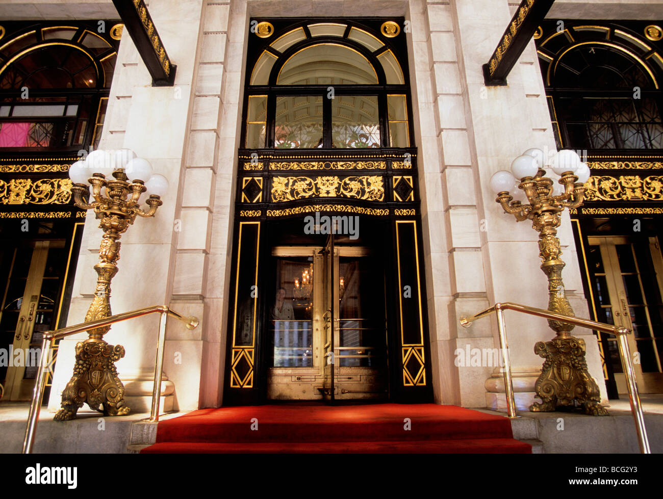 New York Plaza Hotel entrance with red carpet and ornate street lamps. Luxurious exterior on 5th Avenue in Midtown Manhattan, New York City. The Plaza Stock Photo