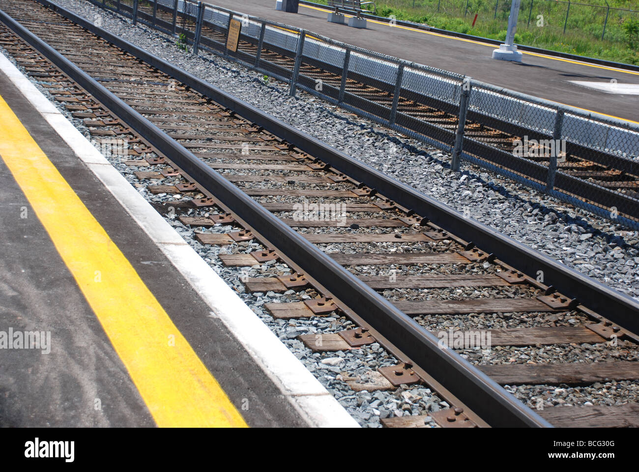 Rail track with yellow line Stock Photo