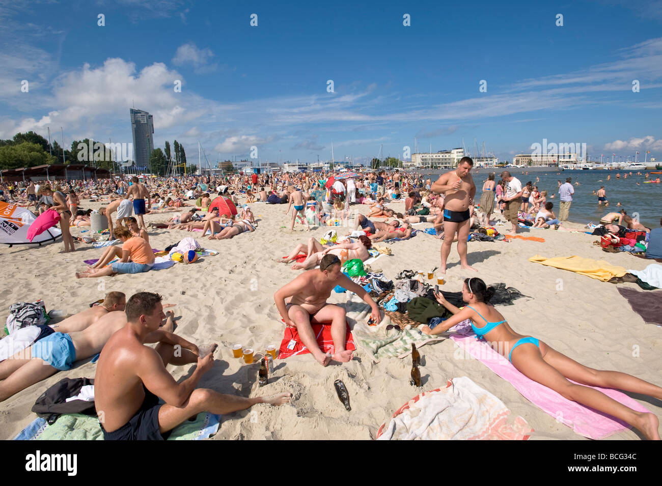 People sunbathing on sandy beach Baltic Sea Gdynia Poland Stock Photo